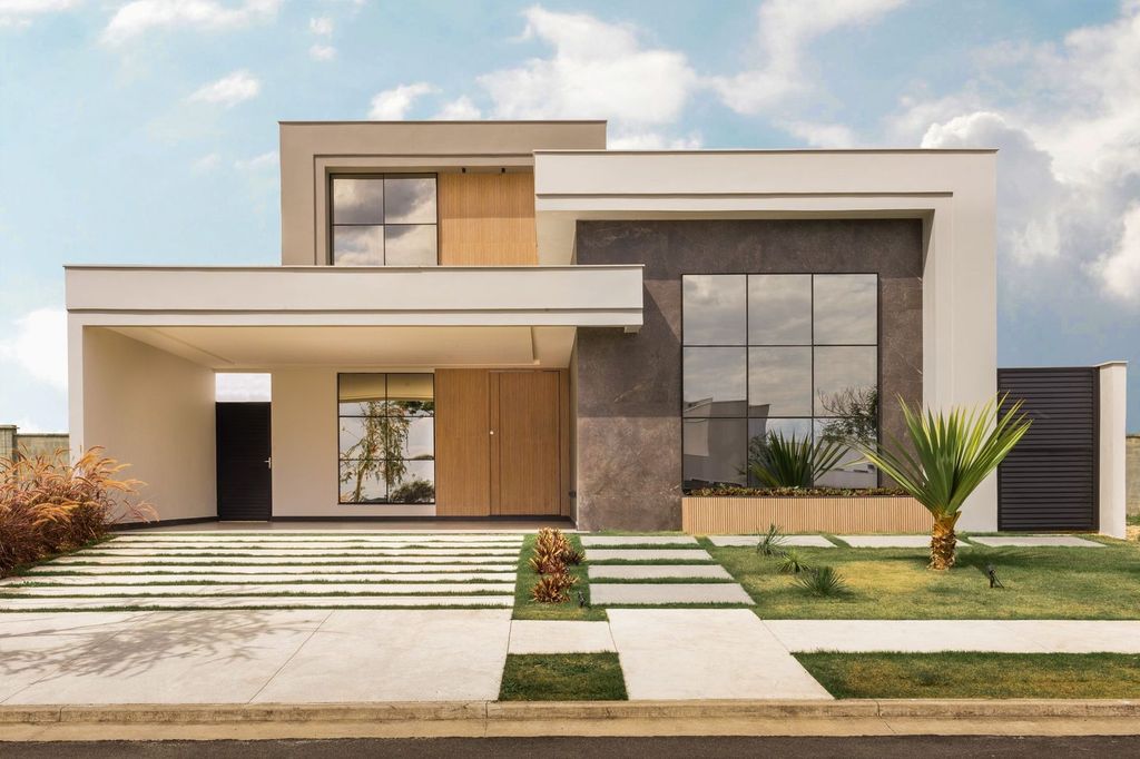 Maison contemporaine : volumes simples, toit plat et grandes baies.